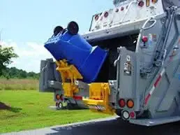 Woman Hospitalized After Garbage Truck Compresses Her